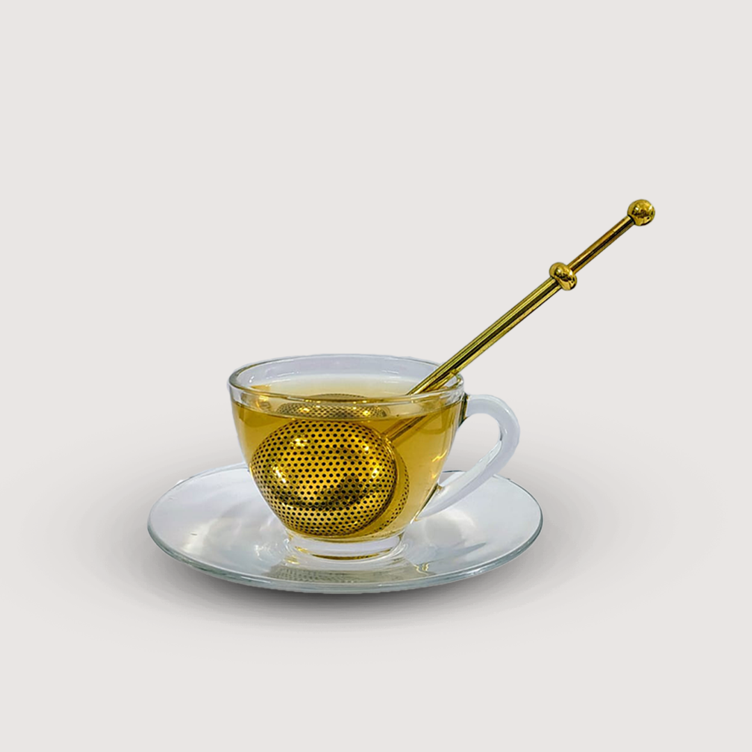 Infuse Bloom - Brass Tea infuser in a cup